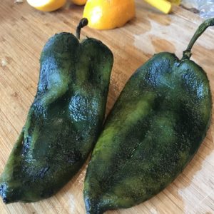Image of roasted and skinned poblano peppers.