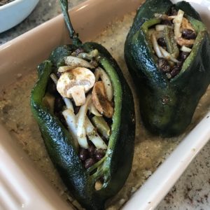 Image of stuffed peppers before the masa dough coating