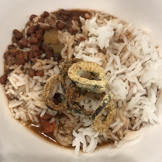 Image of a dish of Cajun red beans and rice with air-fried jalapenos on topCajun, beans, red beans. soup