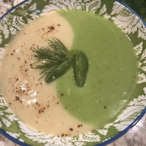 Image of a cold potato and pea soup swirled together in a bowl. 