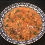 Image of tomato soup with spinach and orzo pasta