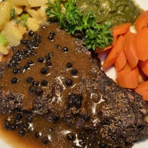 Image of a mushroom steak with peppercorn gravy