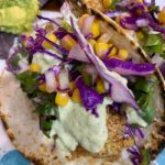 Image of cauliflower taco with red cabbage slaw and poblano crema